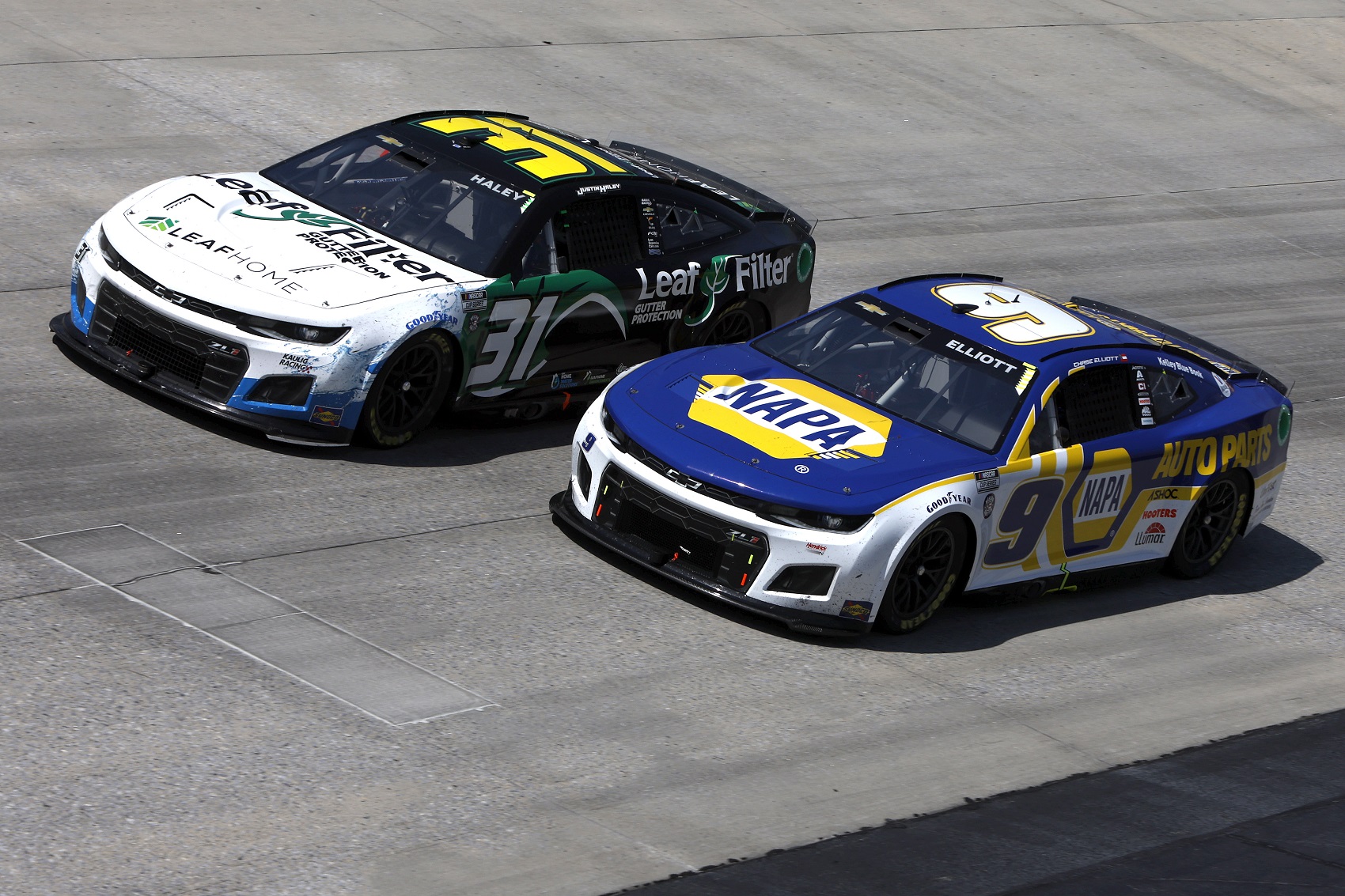 DOVER, DELAWARE - MAY 02: Chase Elliott, driver of the #9 NAPA Auto Parts Chevrolet, and Justin Haley, driver of the #31 LeafFilter Gutter Protection Chevrolet, race during the NASCAR Cup Series DuraMAX Drydene 400 presented by RelaDyne at Dover Motor Speedway on May 02, 2022 in Dover, Delaware