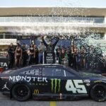 AUSTIN, TEXAS - MARCH 26: Tyler Reddick, driver of the #45 Monster Energy Toyota, celebrates in victory lane after winning the NASCAR Cup Series EchoPark Automotive Grand Prix at Circuit of The Americas on March 26, 2023 in Austin, Texas.