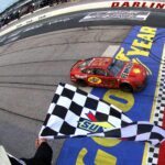 MAY 08: Joey Logano, driver of the #22 Shell Pennzoil Ford, takes the checkered flag to win the NASCAR Cup Series Goodyear 400 at Darlington Raceway on May 08, 2022 in Darlington, South Carolina.