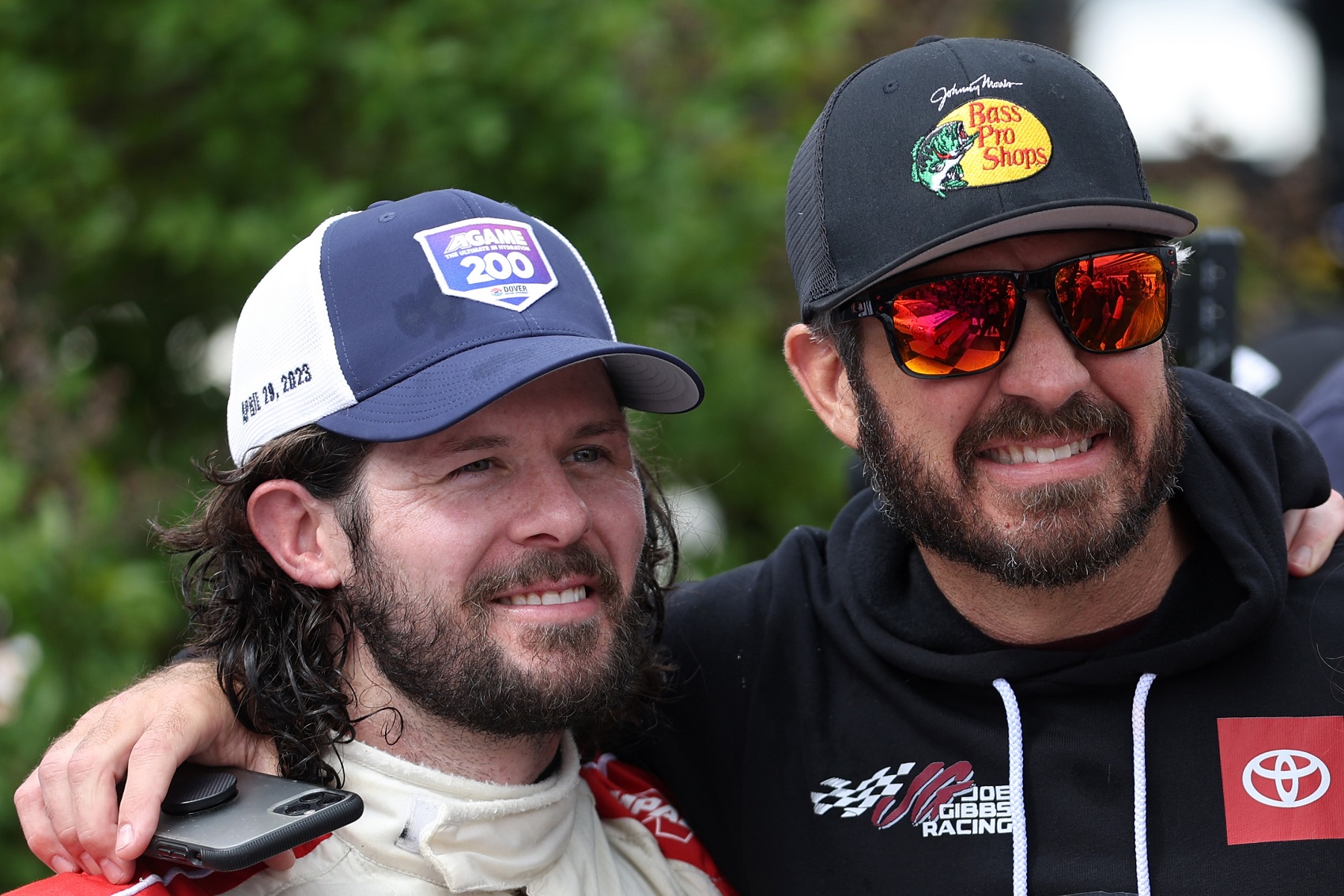 DOVER, DELAWARE - APRIL 29: Ryan Truex, driver of the #19 Toyota Genuine Accessories Toyota, (L) is congratulated by his brother, NASCAR Series Cup driver, Martin Truex Jr. in victory lane after winning the NASCAR Xfinity Series A-GAME 200 at Dover International Speedway on April 29, 2023 in Dover, Delaware