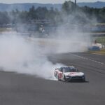 PORTLAND, OREGON - JUNE 03: Cole Custer, driver of the #00 Haas Automation Ford, celebrates with a burnout after winning the NASCAR Xfinity Series Pacific Office Automation 147 at Portland International Raceway on June 03, 2023 in Portland, Oregon