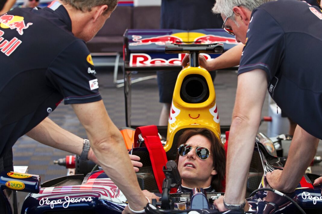 Tom Cruise is tutored by former F1 race driver David Coulthard as he prepares to drive the Red Bull F1 Race Car at Willow Springs Raceway, Rosamond, CA, USA, on 15 August 2011