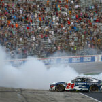 FORT WORTH, TEXAS - SEPTEMBER 24: William Byron, driver of the #24 Liberty University Chevrolet, celebrates with a burnout after winning the NASCAR Cup Series Autotrader EchoPark Automotive 400 at Texas Motor Speedway on September 24, 2023 in Fort Worth, Texas.