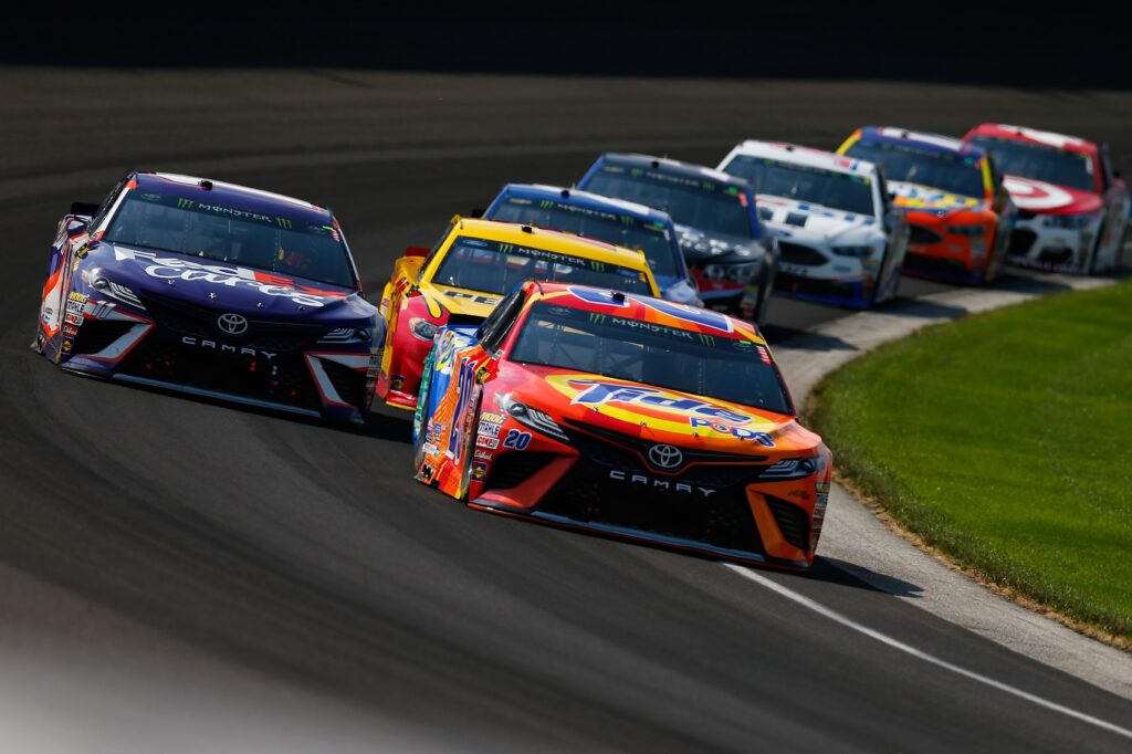 INDIANAPOLIS, IN - JULY 23:  Matt Kenseth, driver of the #20 Tide Pods Toyota, leads a pack of cars during the Monster Energy NASCAR Cup Series Brickyard 400 at Indianapolis Motorspeedway on July 23, 2017 in Indianapolis, Indiana